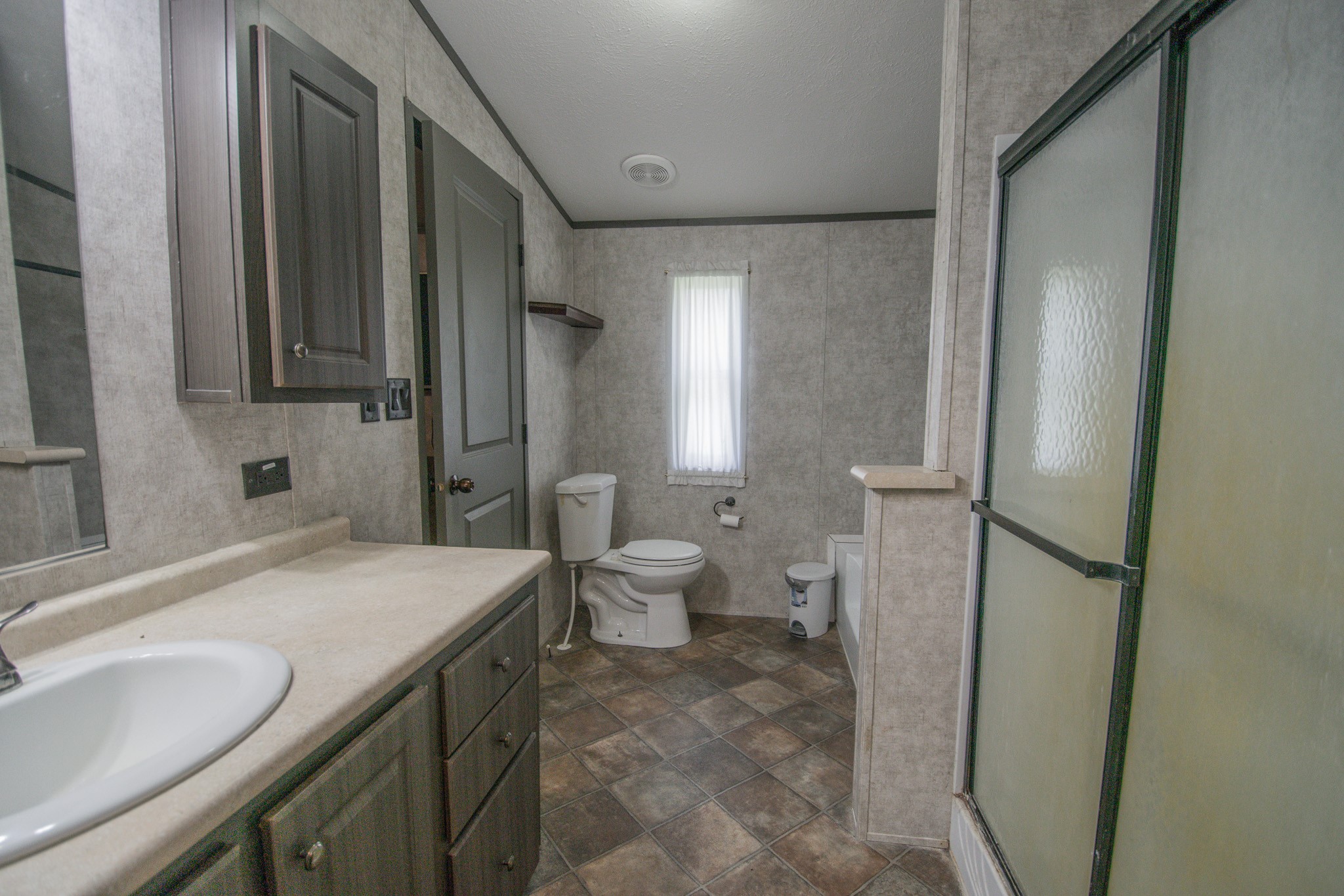 2801 County Road 444 Angleton, TX 77515 - Photo 17 of 38 a bathroom with a sink and a mirror