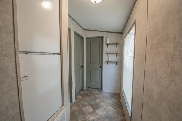 a room with a bed and a window in it