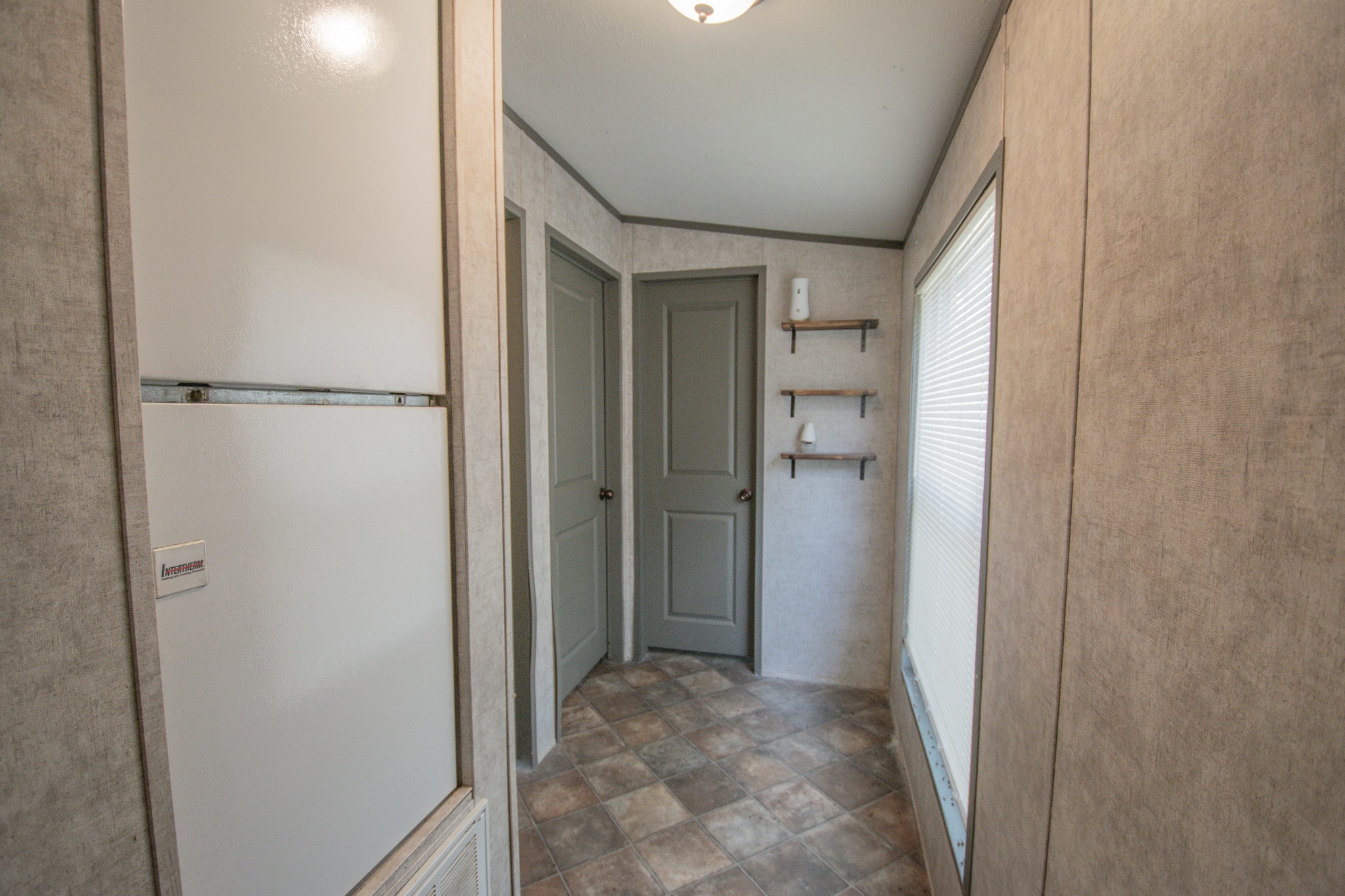 2801 County Road 444 Angleton, TX 77515 - Photo 19 of 38 a view of a hallway with closet and wooden floor