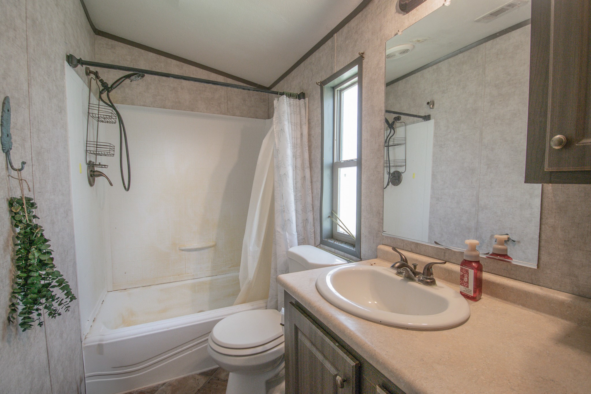 2801 County Road 444 Angleton, TX 77515 - Photo 20 of 37 a bathroom with a sink toilet and a mirror