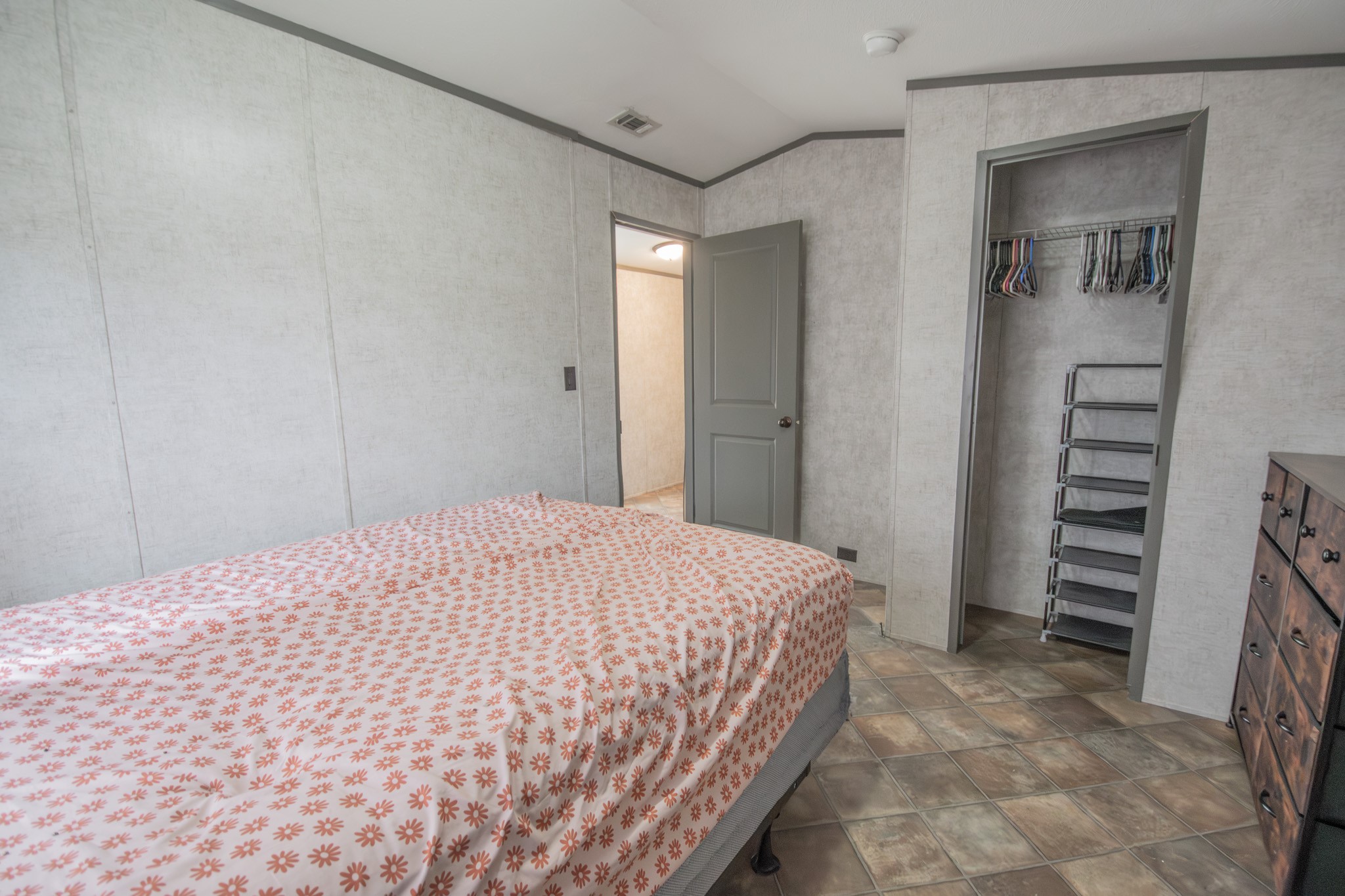 2801 County Road 444 Angleton, TX 77515 - Photo 22 of 37 a bedroom with a bed and a television