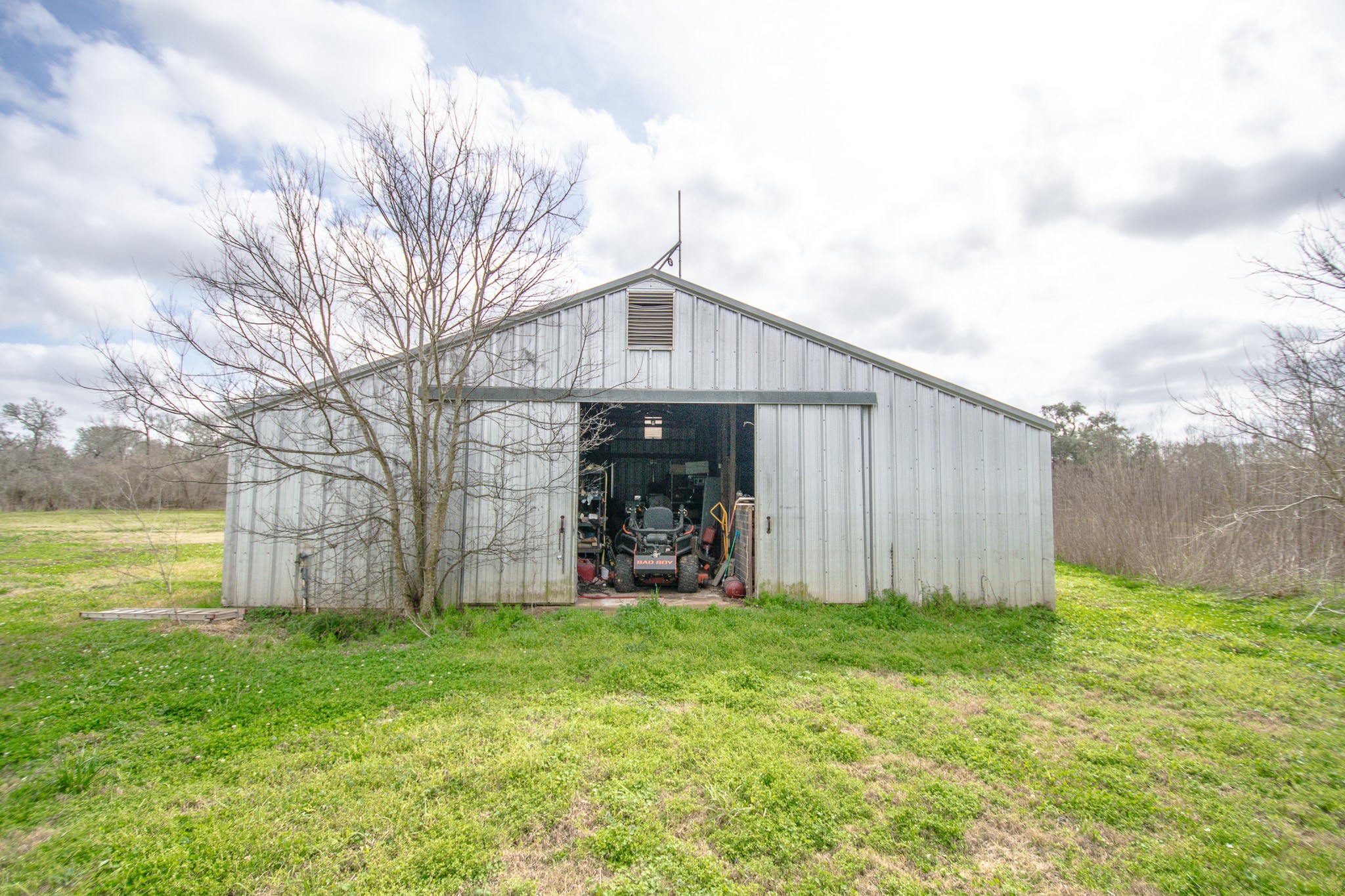 2801 County Road 444 Angleton, TX 77515 - Photo 28 of 37 a front view of a house with garden