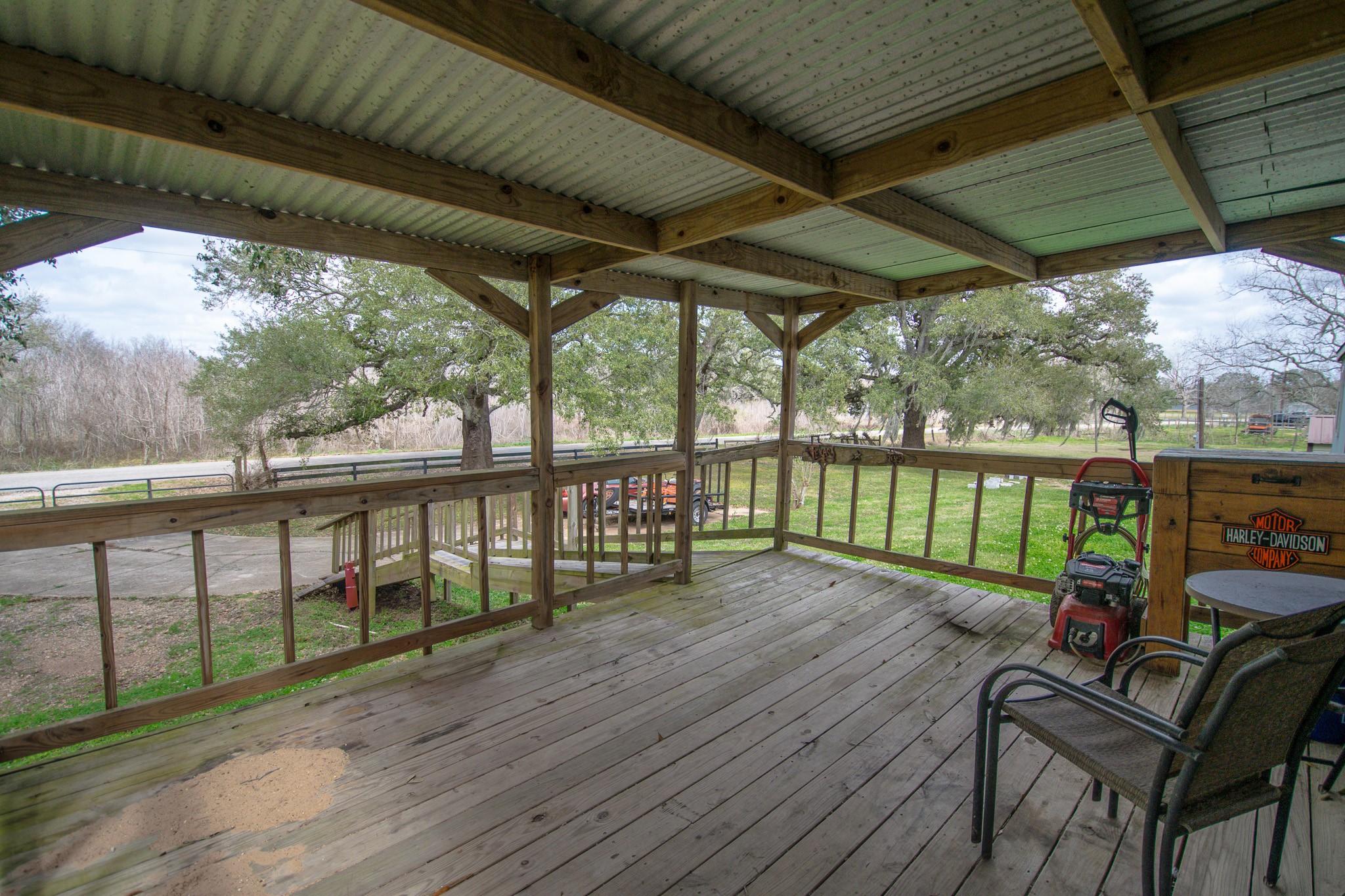 2801 County Road 444 Angleton, TX 77515 - Photo 6 of 37 a view of a two chairs in the deck