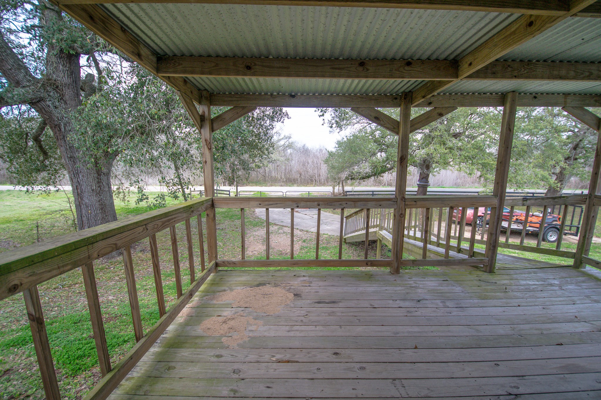 2801 County Road 444 Angleton, TX 77515 - Photo 6 of 38 a porch with a table and chairs