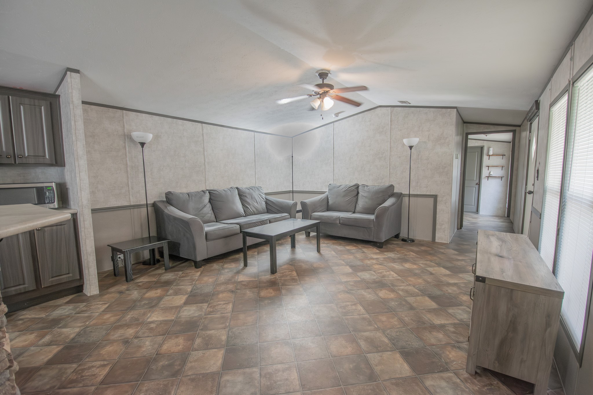 2801 County Road 444 Angleton, TX 77515 - Photo 9 of 37 a living room with furniture and a chandelier