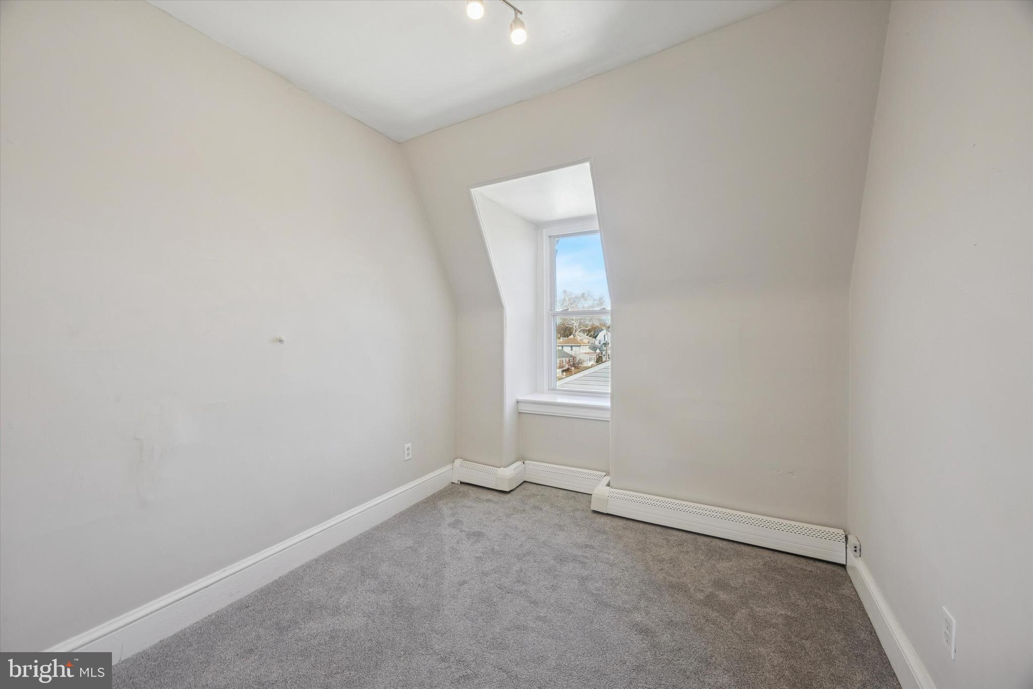 222 Henderson Avenue, Unit 3 Ridley Park, PA 19078 - Photo 11 of 15 an empty room with windows