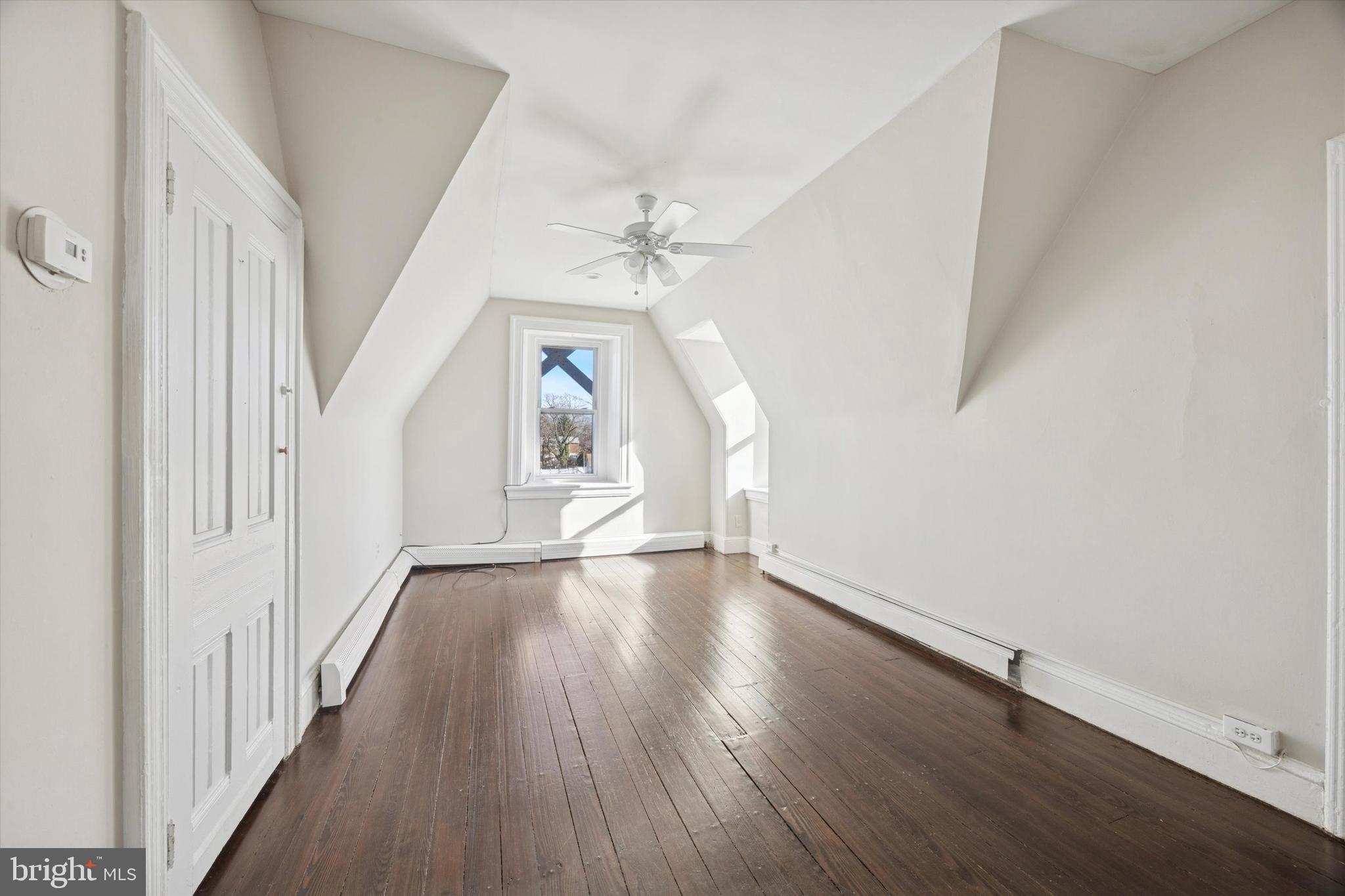 222 Henderson Avenue, Unit 3 Ridley Park, PA 19078 - Photo 3 of 15 wooden floor in an empty room with a window