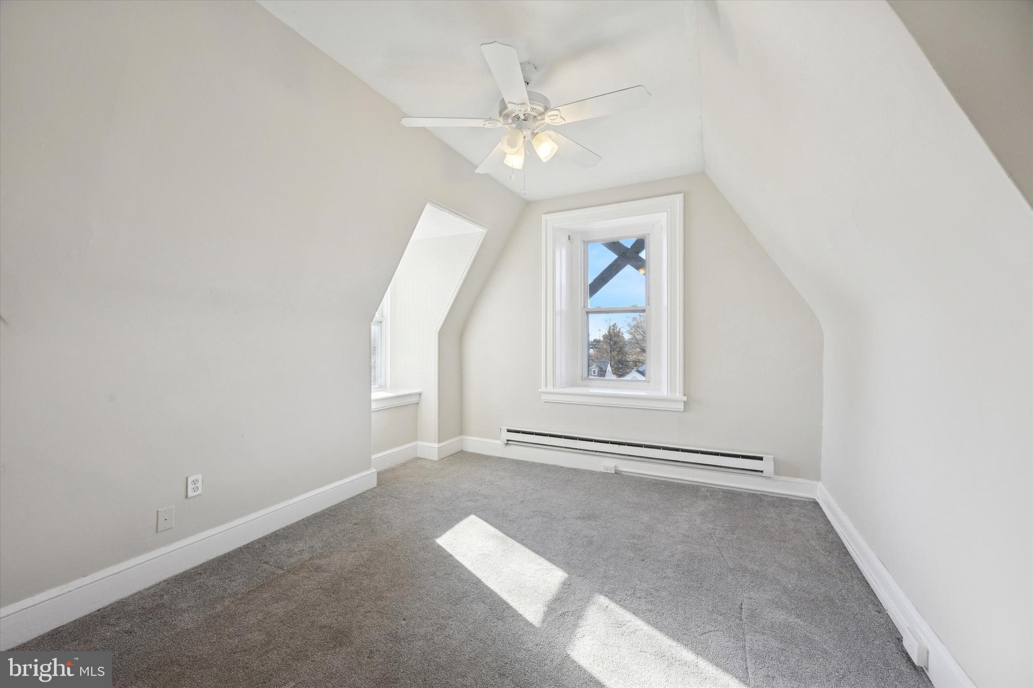 222 Henderson Avenue, Unit 3 Ridley Park, PA 19078 - Photo 9 of 15 an empty room with windows and fan