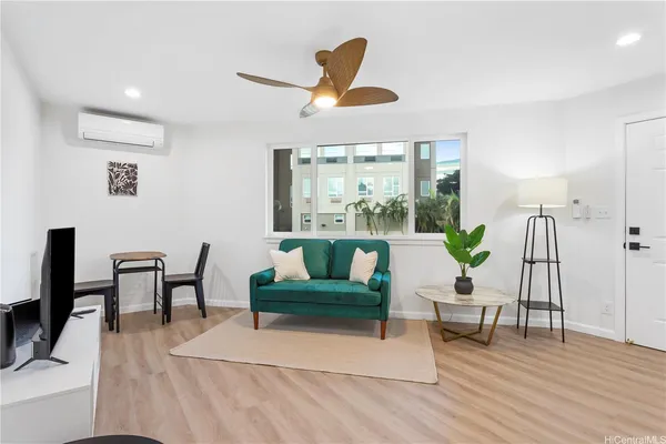 a living room with furniture and a large window