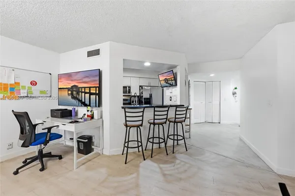 a view of a workspace with furniture