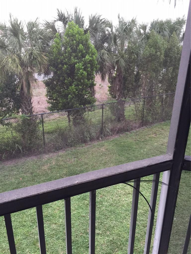 3470 Foxcroft Road, Unit 211 Miramar, FL 33025 - Photo 3 of 10 a view of a yard from a balcony