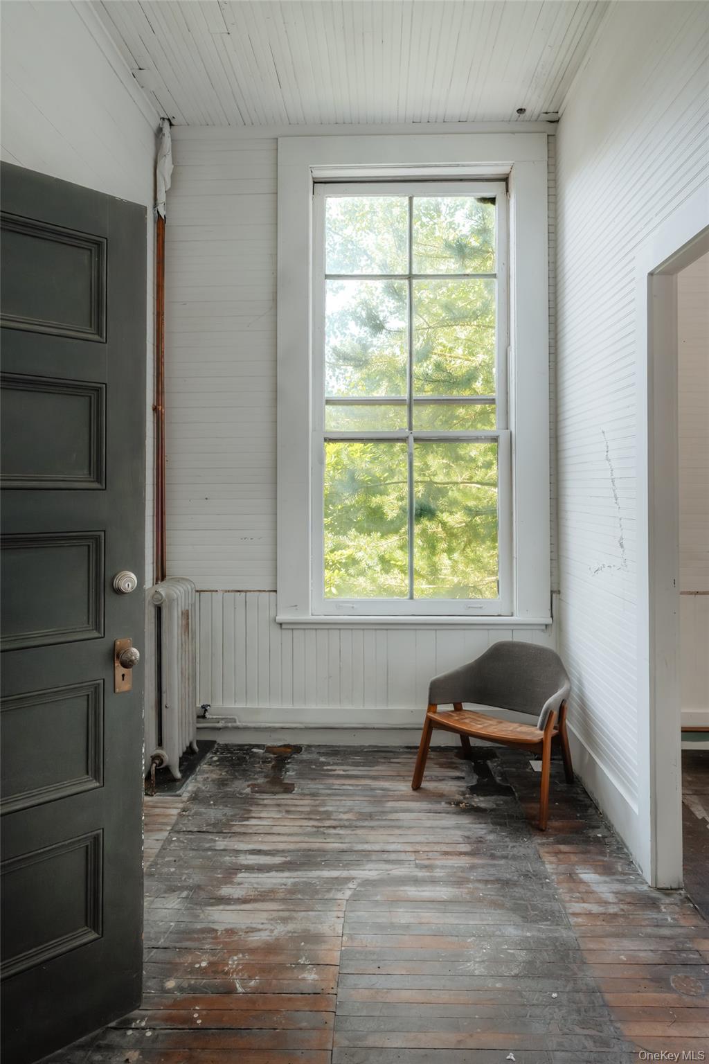 48 Upper Main Street Callicoon, NY 12723 - Photo 11 of 48 Sunroom featuring radiator heating unit