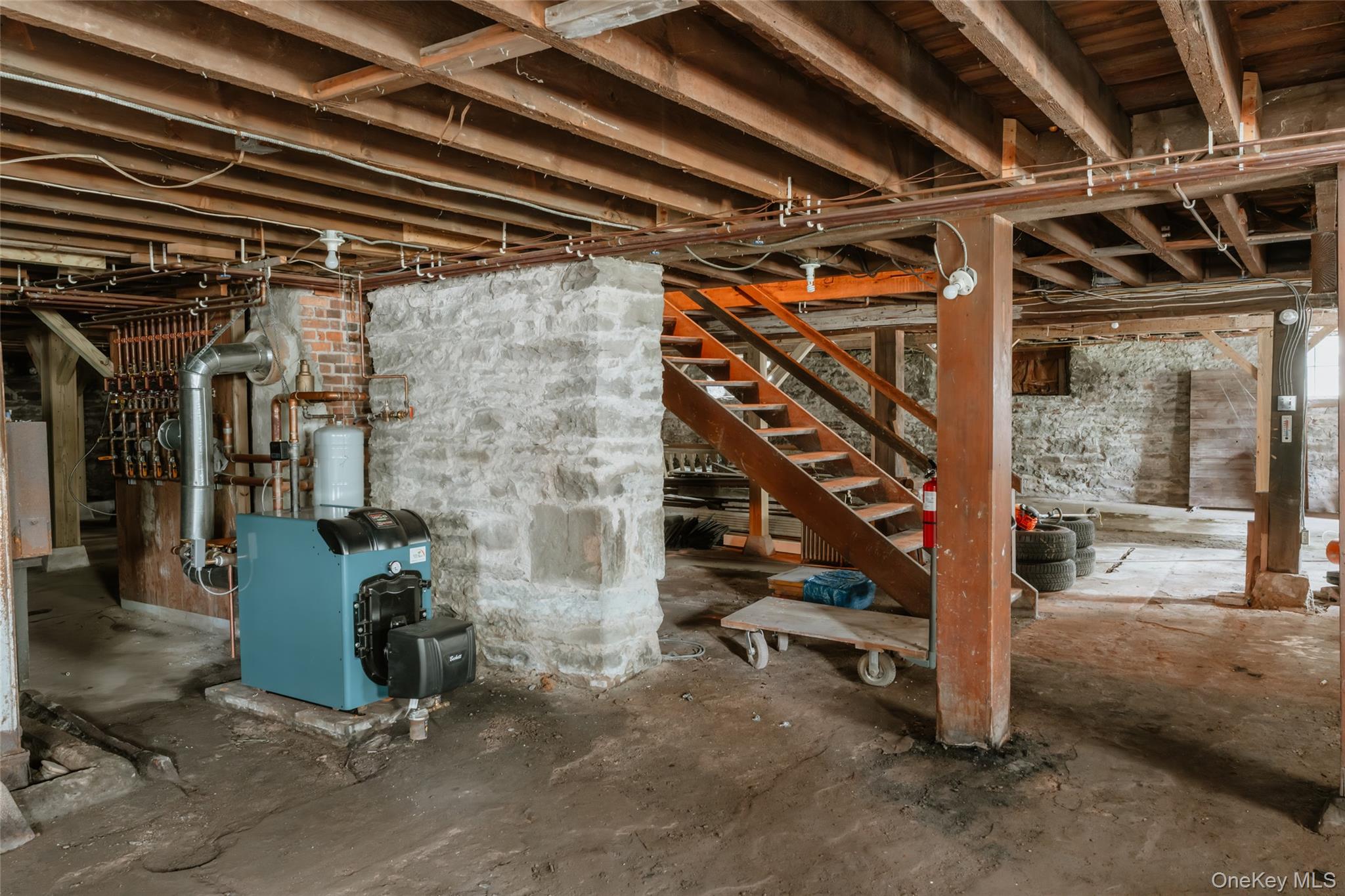 48 Upper Main Street Callicoon, NY 12723 - Photo 42 of 48 Unfinished basement featuring a heating unit and stairs