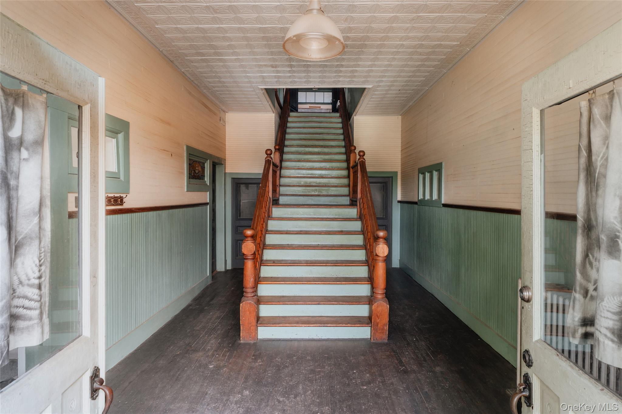 48 Upper Main Street Callicoon, NY 12723 - Photo 6 of 48 Stairway featuring hardwood / wood-style flooring and an ornate ceiling