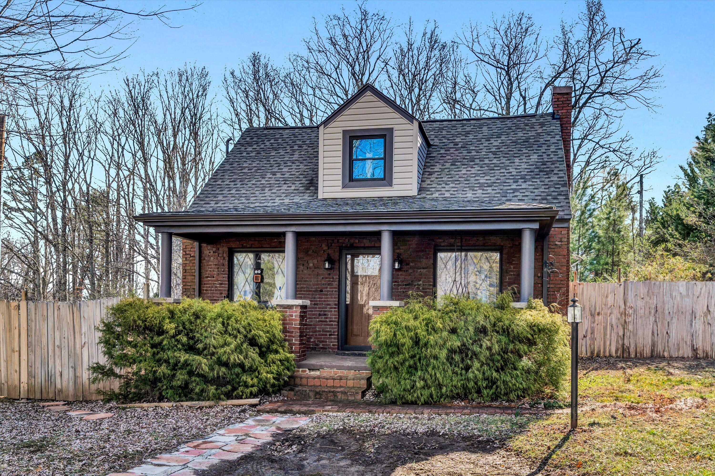 1120 Turner Branch Road Goodview, VA 24095 - Photo 1 of 35 a front view of a house with garden