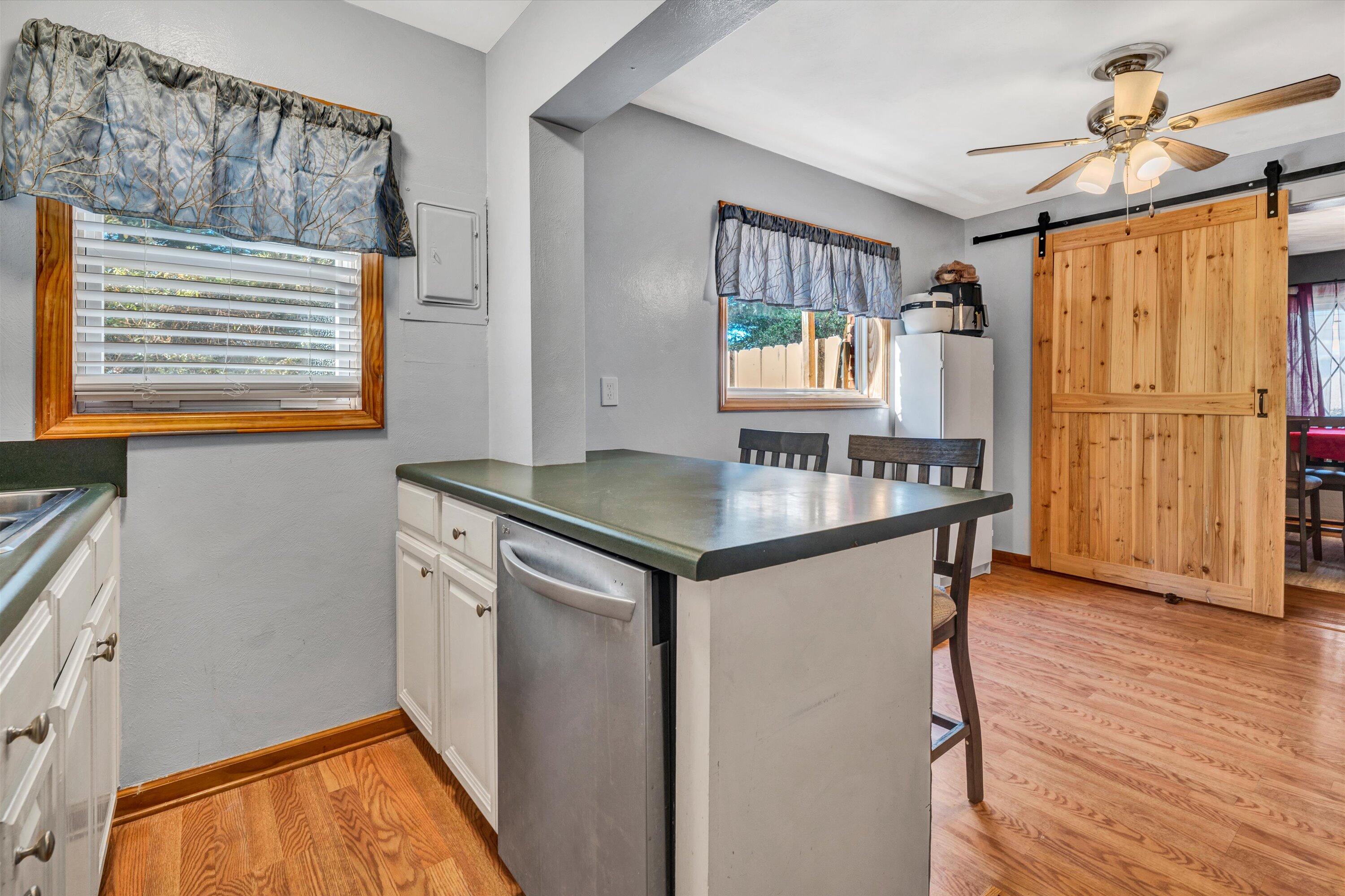 1120 Turner Branch Road Goodview, VA 24095 - Photo 13 of 35 a kitchen with stainless steel appliances granite countertop a stove and a refrigerator