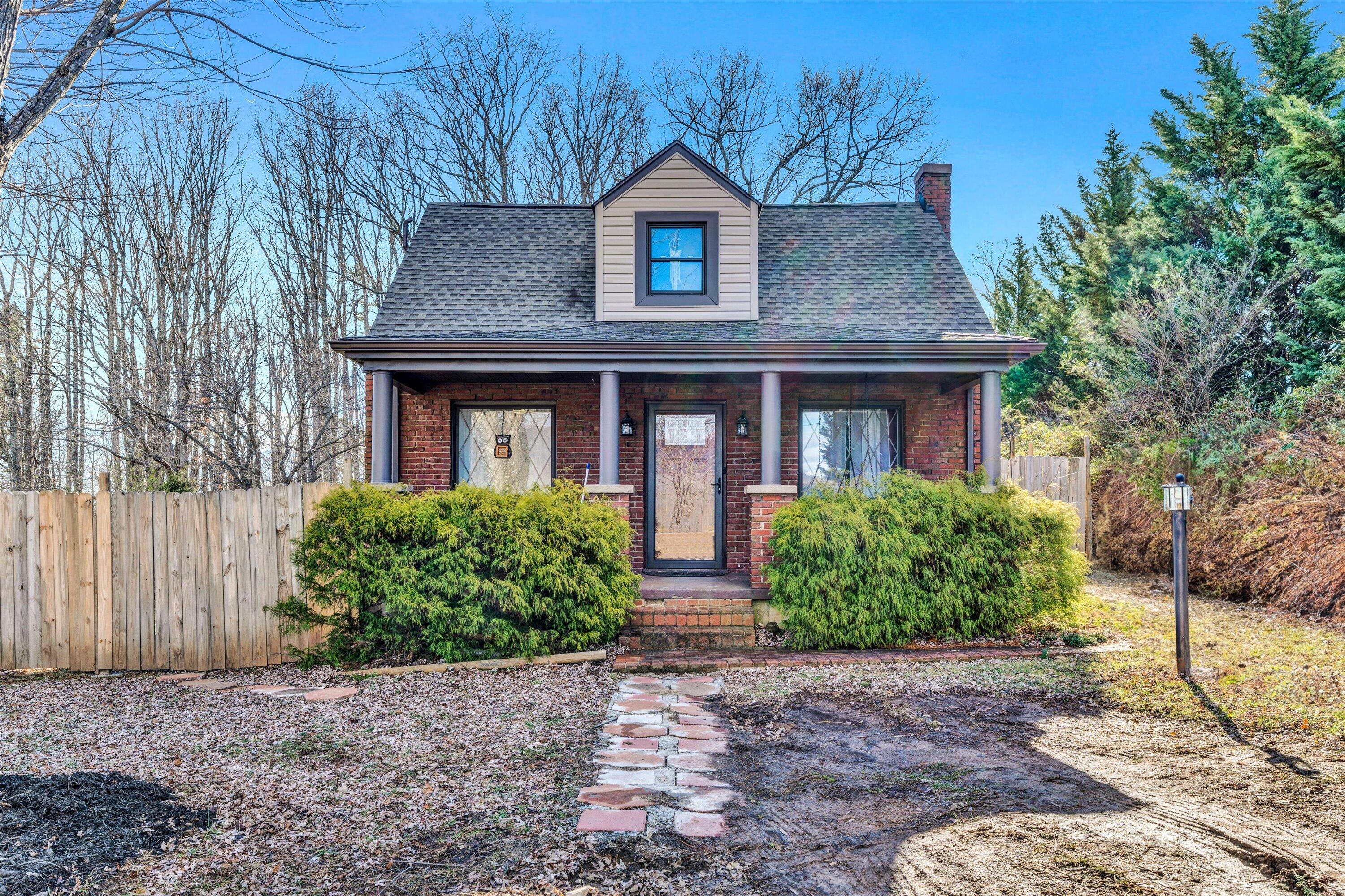 1120 Turner Branch Road Goodview, VA 24095 - Photo 2 of 35 a front view of a house with garden