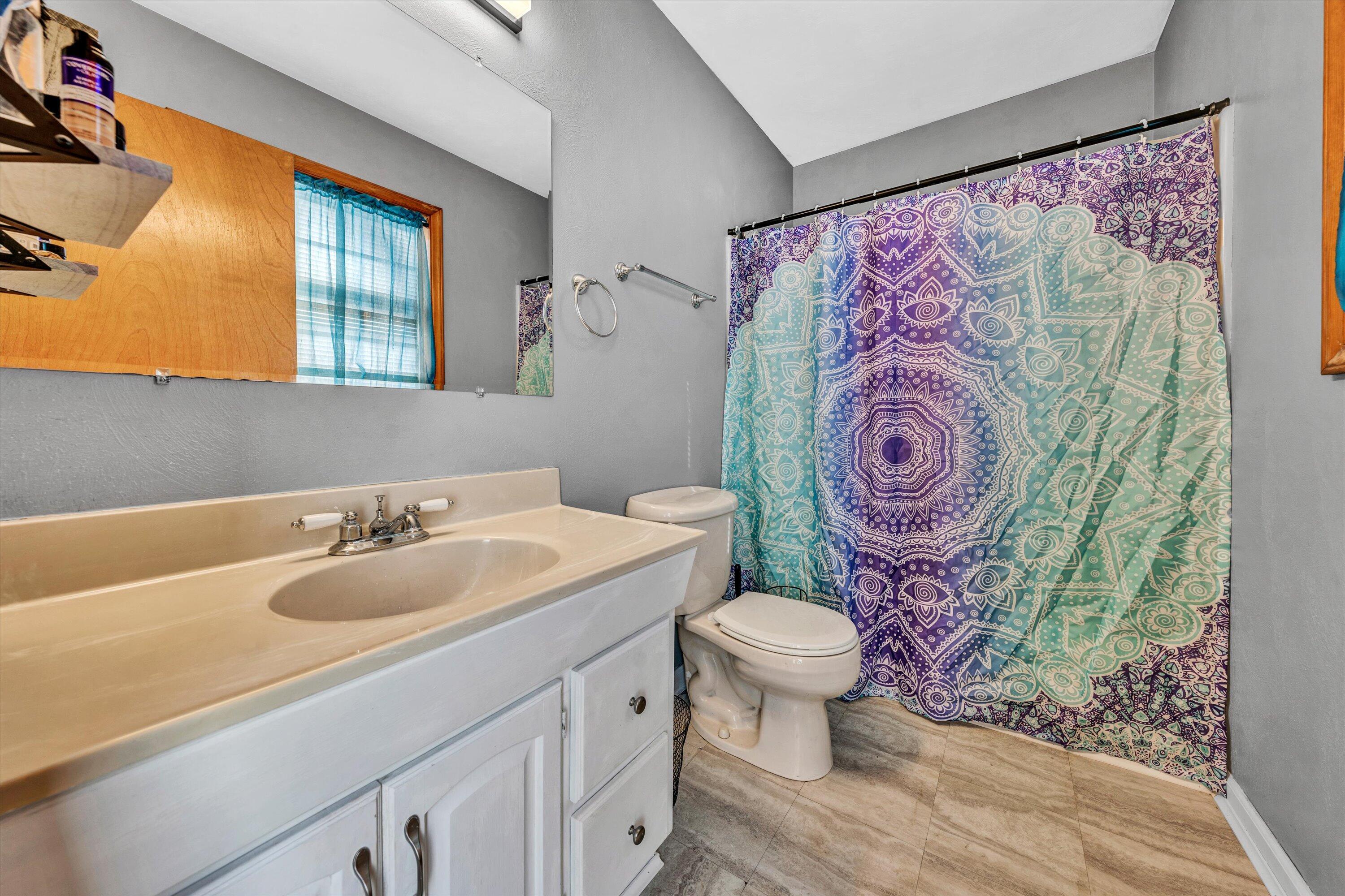 1120 Turner Branch Road Goodview, VA 24095 - Photo 25 of 35 a bathroom with a toilet sink and mirror