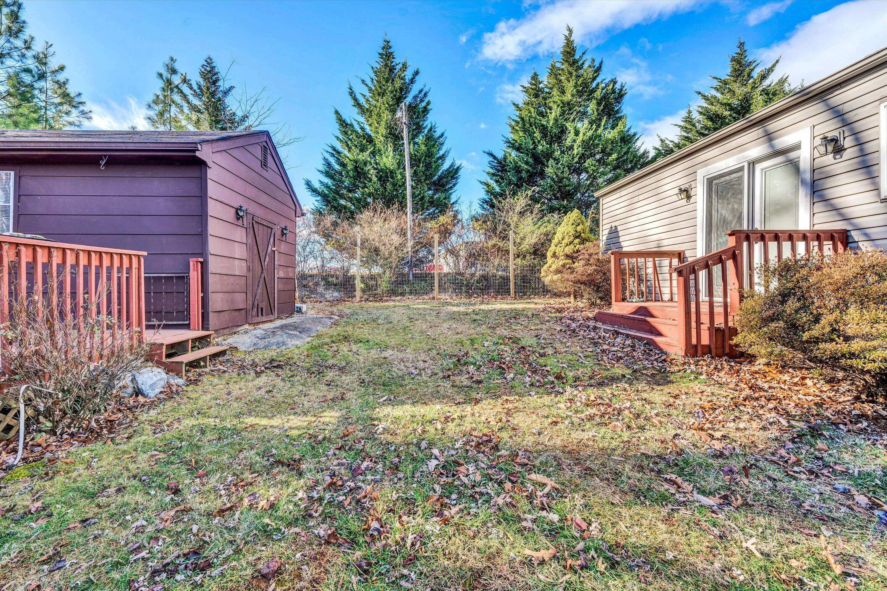 1120 Turner Branch Road Goodview, VA 24095 - Photo 29 of 35 a backyard of a house with plants and outdoor seating