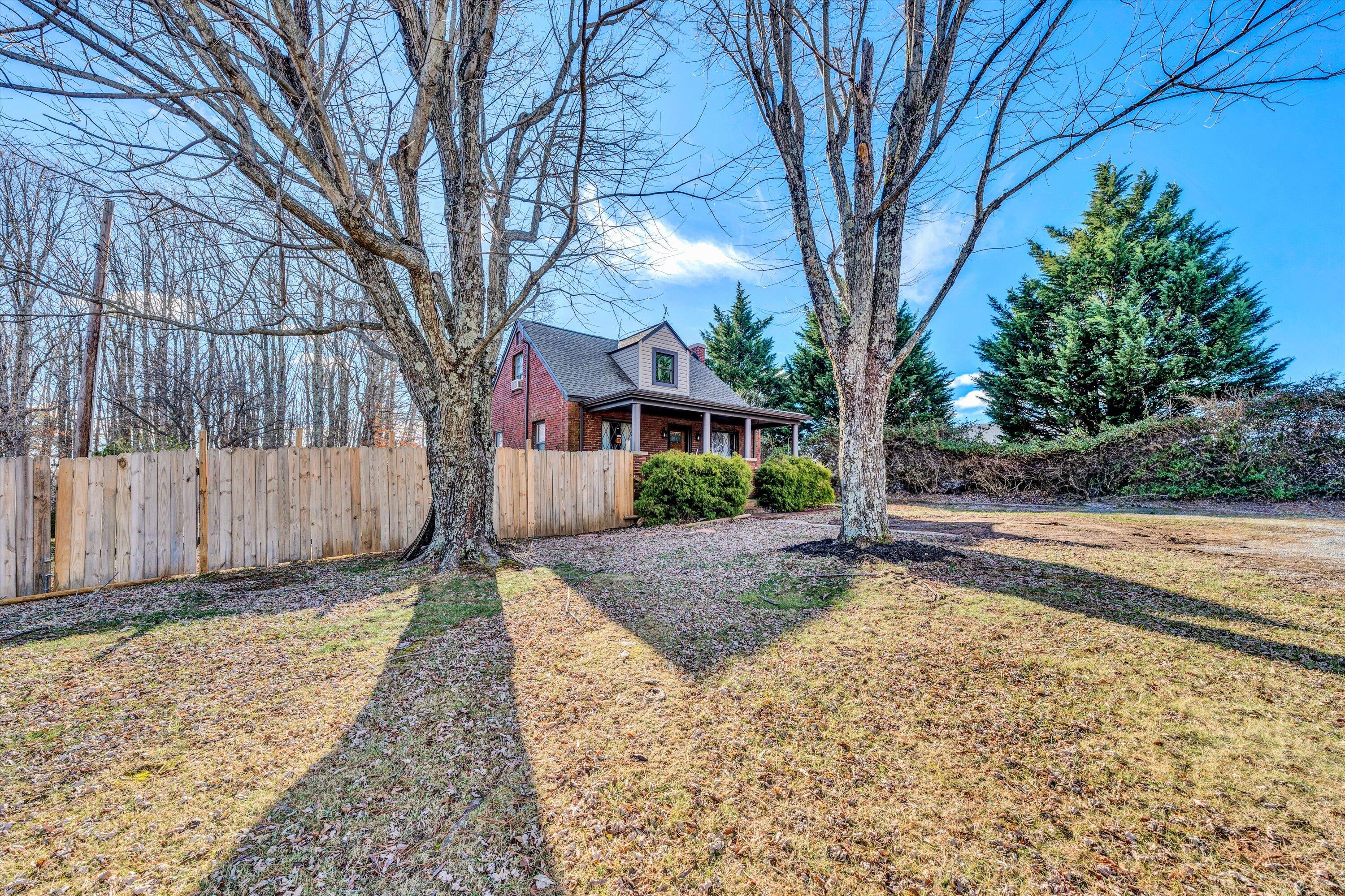 1120 Turner Branch Road Goodview, VA 24095 - Photo 3 of 35 a view of a yard with a house and tree s