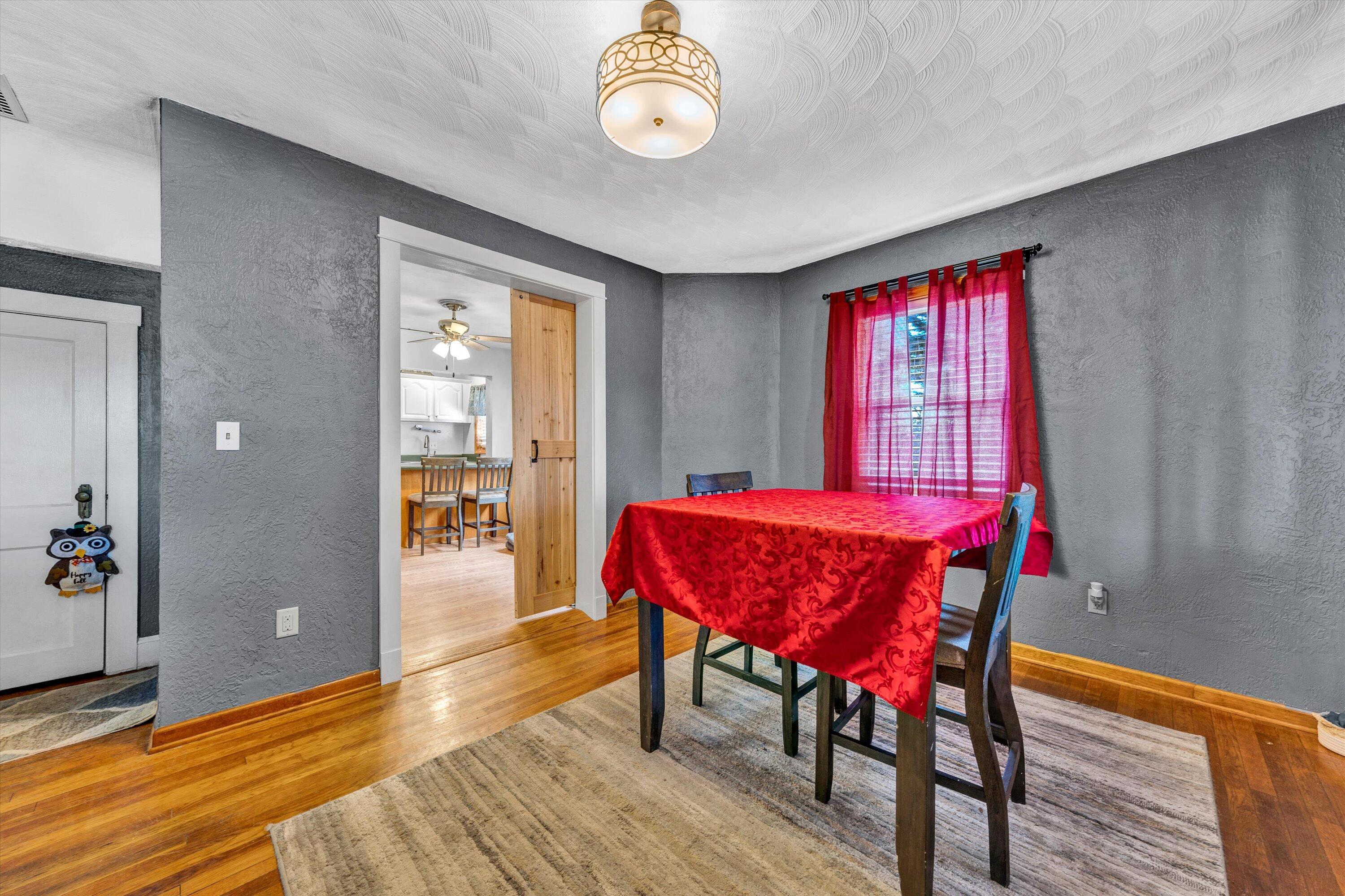 1120 Turner Branch Road Goodview, VA 24095 - Photo 7 of 35 a view of a dining room with furniture and wooden floor