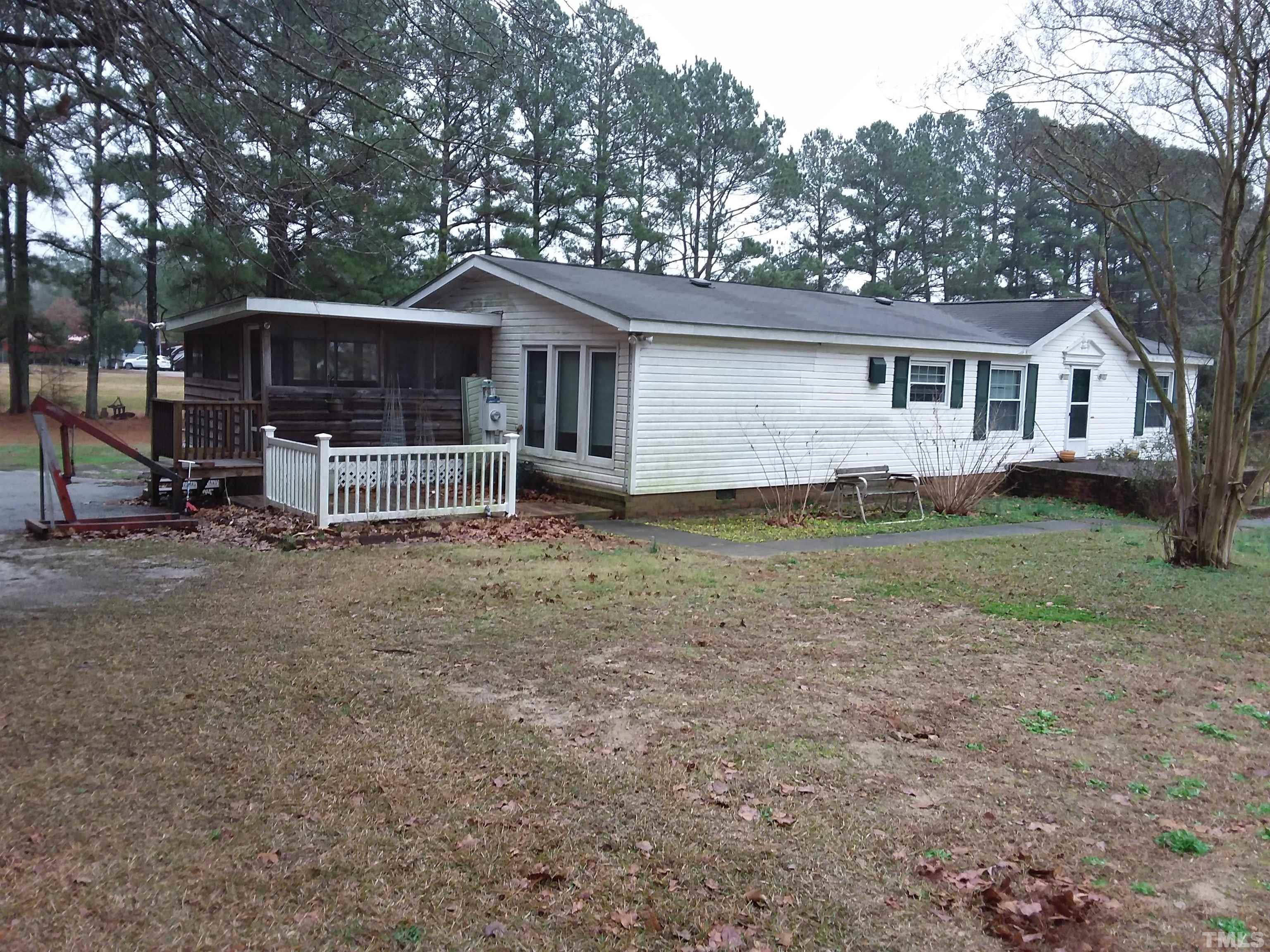 4644 Dusty Road Raleigh, NC 27610 - Photo 3 of 12 a house that has a tree in front of it