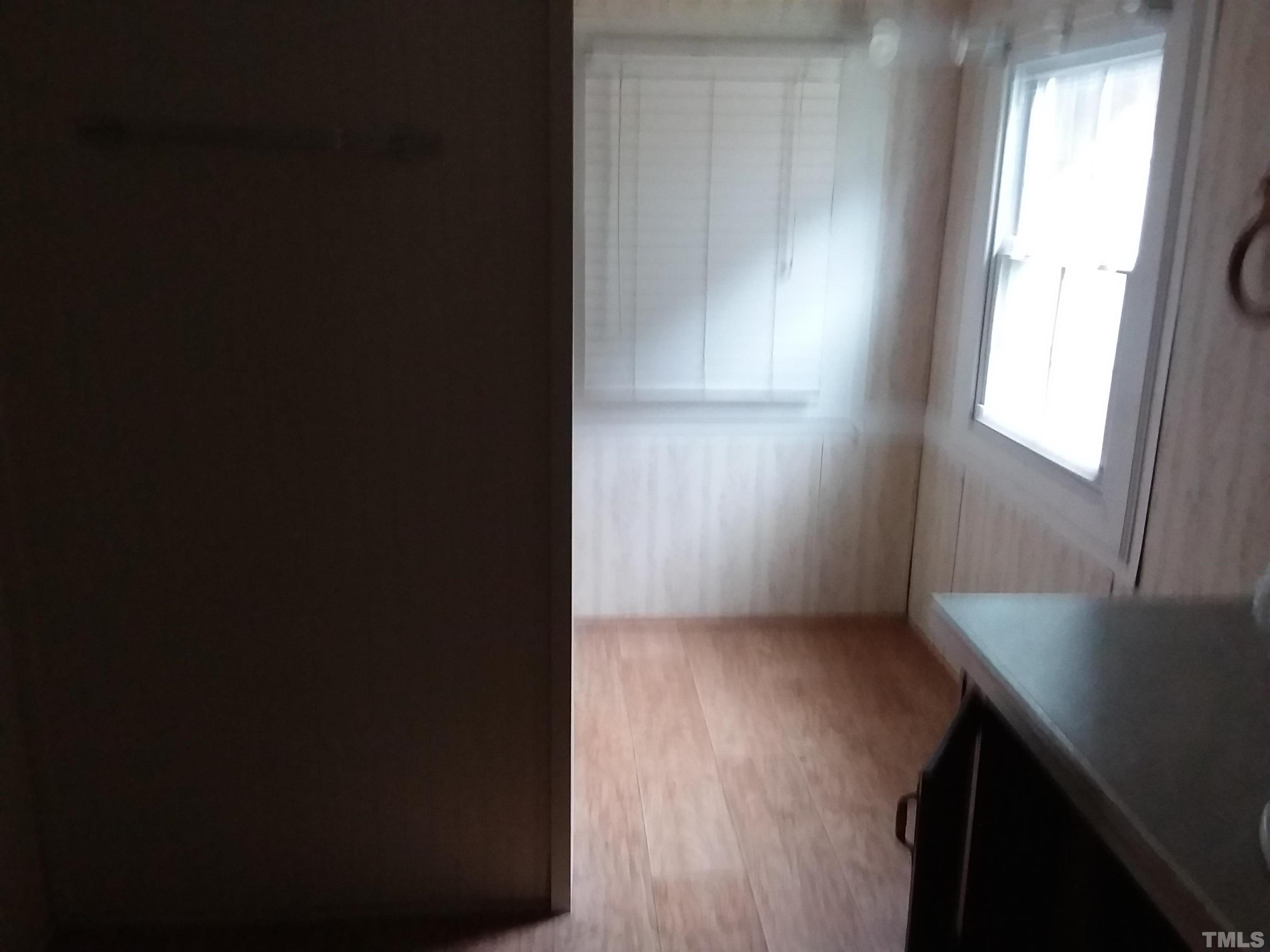4644 Dusty Road Raleigh, NC 27610 - Photo 10 of 12 a view of an empty room with a window