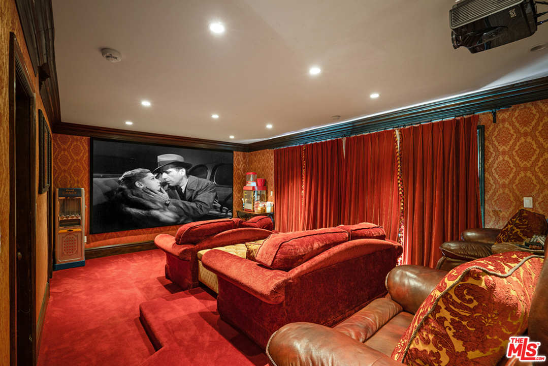 1016 Moraga Drive Los Angeles, CA 90049 - Photo 15 of 30 a bed room with furniture and a rug