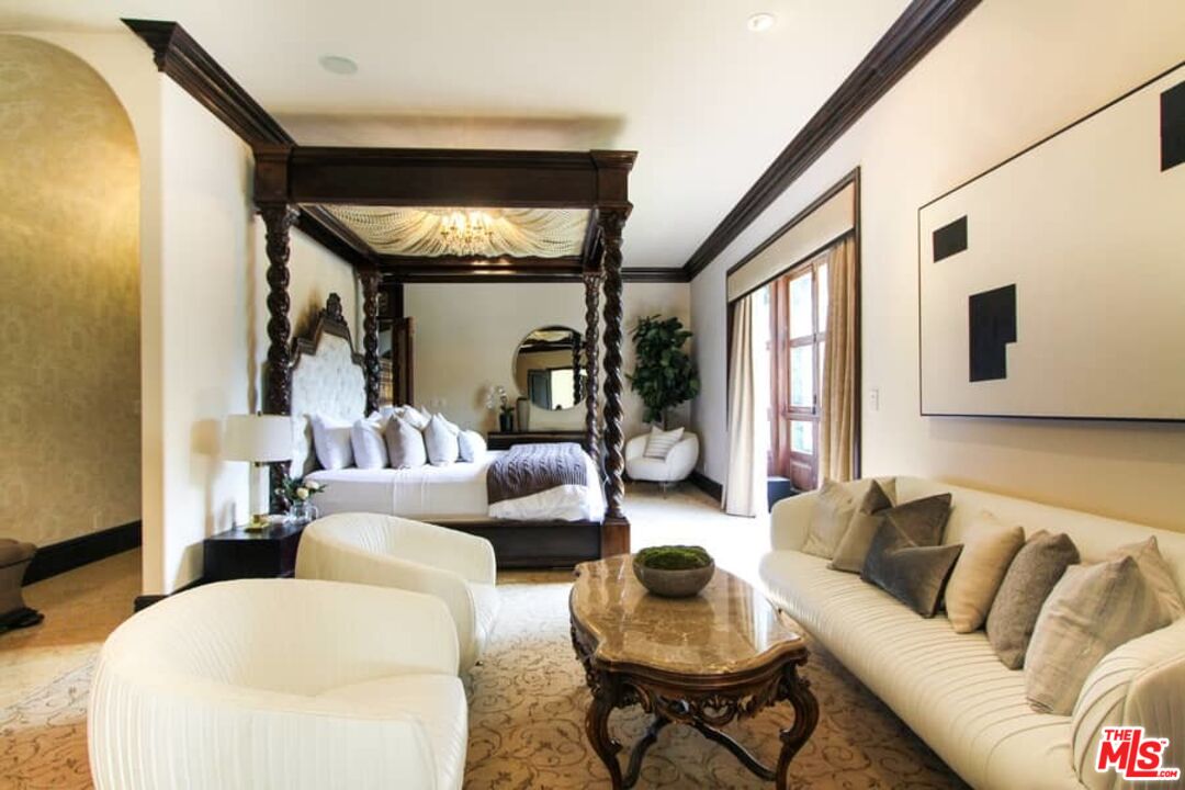 1016 Moraga Drive Los Angeles, CA 90049 - Photo 17 of 30 a living room with furniture and floor to ceiling window