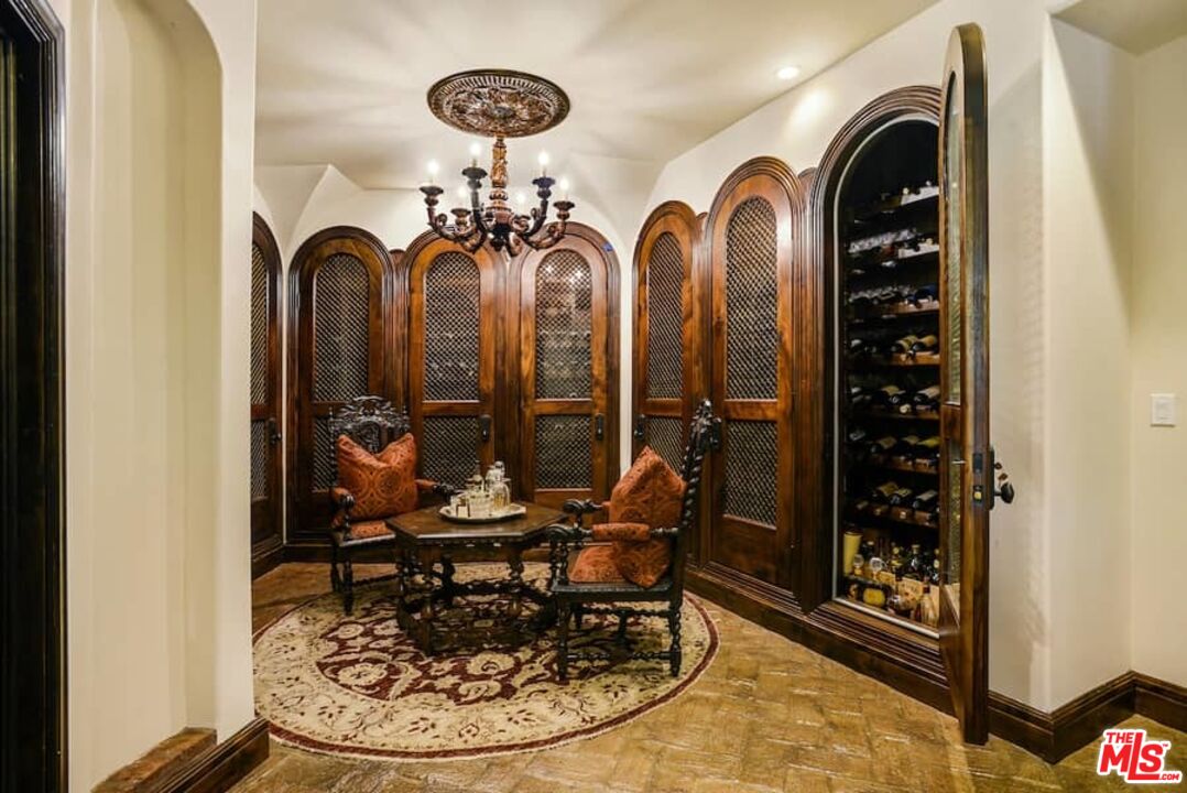 1016 Moraga Drive Los Angeles, CA 90049 - Photo 20 of 30 a spacious bathroom with a sink a toilet a mirror and shower