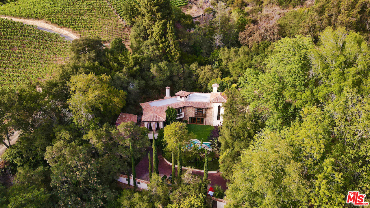 1016 Moraga Drive Los Angeles, CA 90049 - Photo 2 of 30 a view of a garden