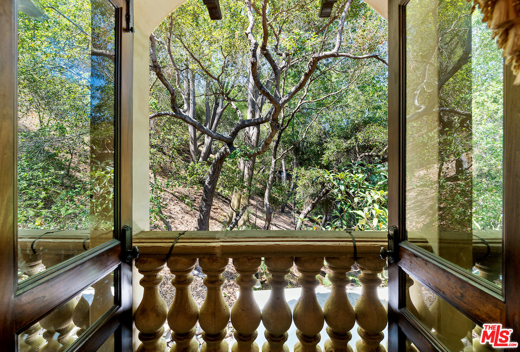 1016 Moraga Drive Los Angeles, CA 90049 - Photo 24 of 30 a view of a wooden balcony