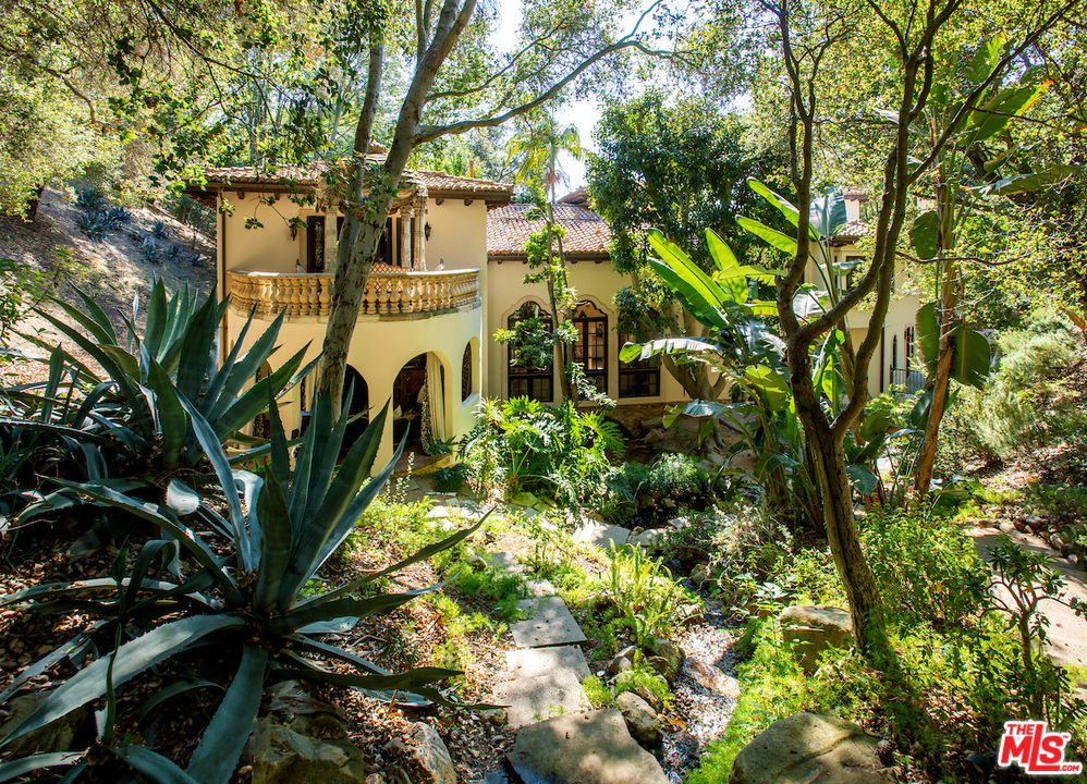 1016 Moraga Drive Los Angeles, CA 90049 - Photo 25 of 30 a view of a wooden balcony