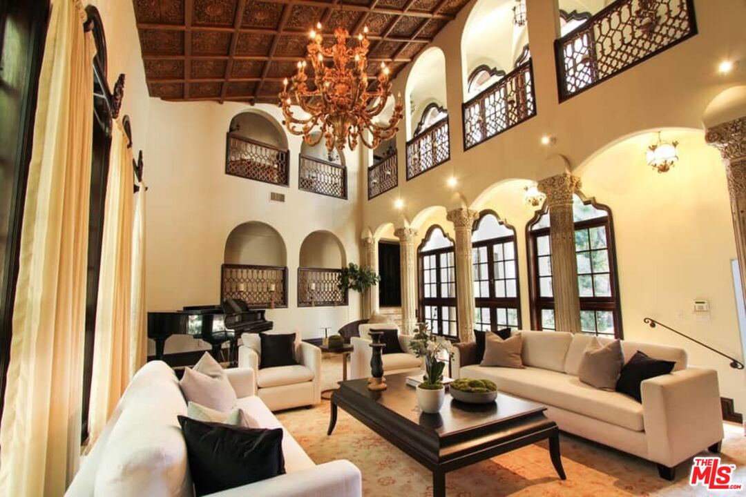 1016 Moraga Drive Los Angeles, CA 90049 - Photo 6 of 30 a living room with furniture and a fireplace