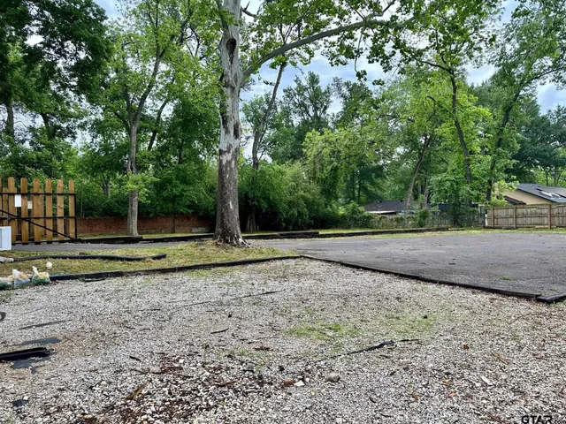 a view of outdoor space with iron fence