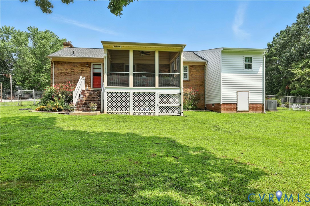 11407 Delgado Road Midlothian, VA 23112 - Photo 27 of 35 a large house with a garden in front of it