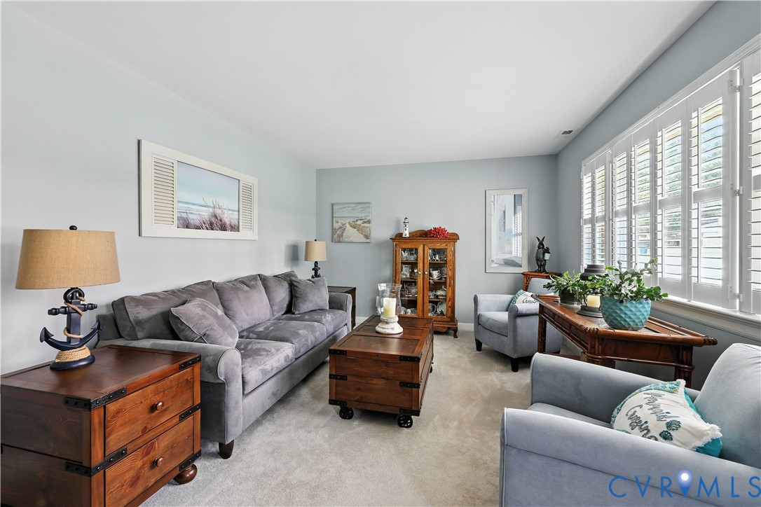 11407 Delgado Road Midlothian, VA 23112 - Photo 5 of 35 a living room with furniture and a large window