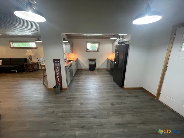 a view of a livingroom with furniture and a wooden floor