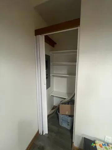 a room with a wooden floor and a chair