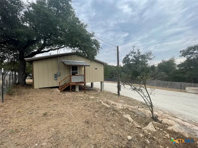 a house view with a backyard space