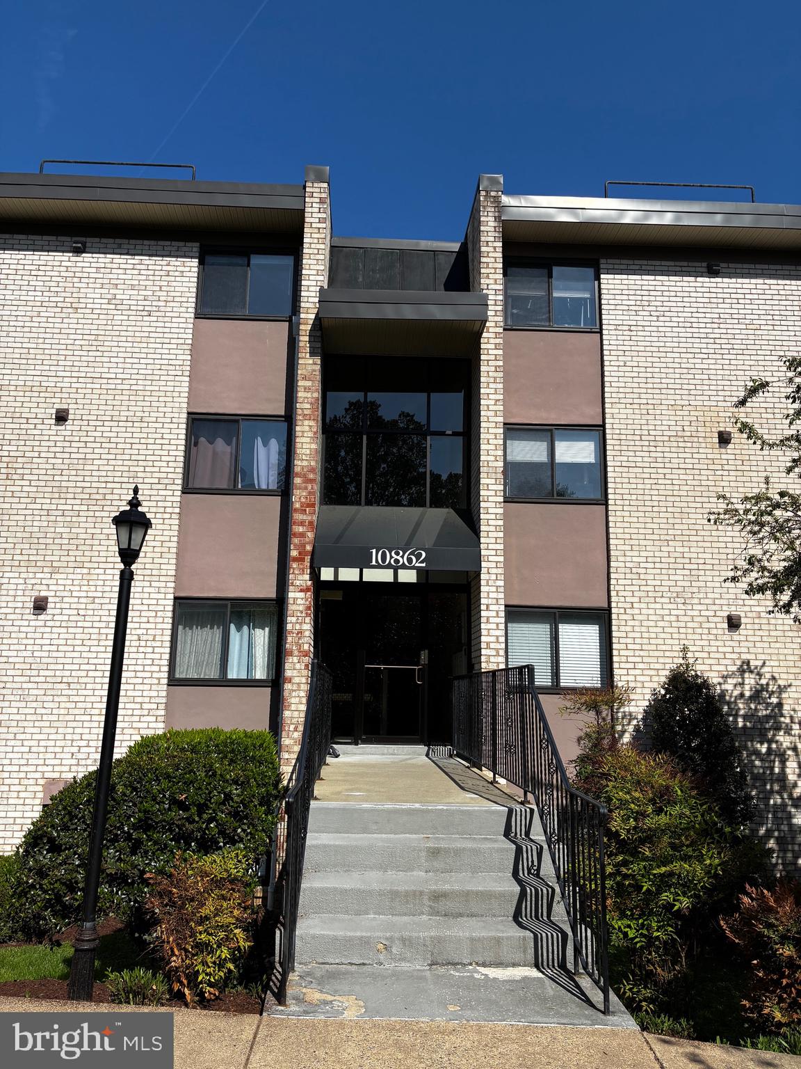 10862 Bucknell Drive, Unit 301 Silver Spring, MD 20902 - Photo 30 of 32 a front view of a house with stairs