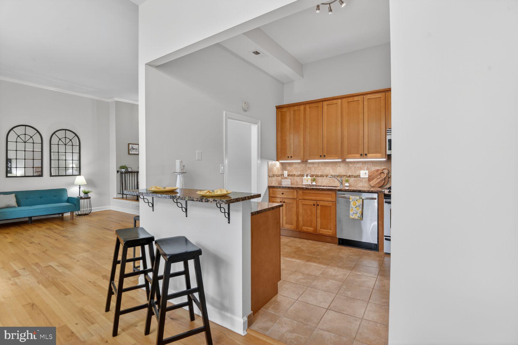 10862 Bucknell Drive, Unit 301 Silver Spring, MD 20902 - Photo 3 of 32 Kitchen- Bar stool area
