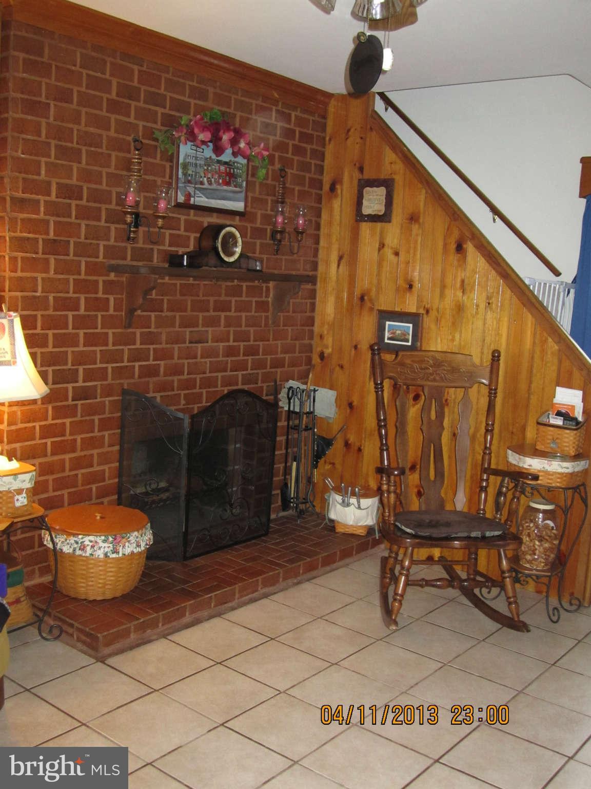 1224-7 Seven Oaks Road Baltimore, MD 21227 - Photo 6 of 28 Living Room shows fireplace