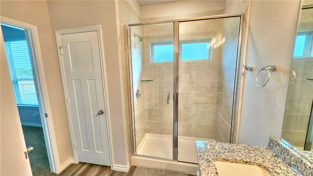 a bathroom with a bathtub and a shower