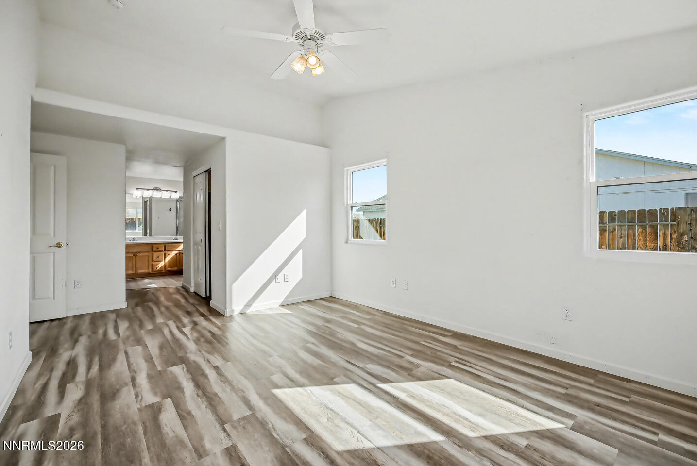 133 Prairie Lane Fernley, NV 89408 - Photo 14 of 22 a view of a livingroom with wooden floor and stairs