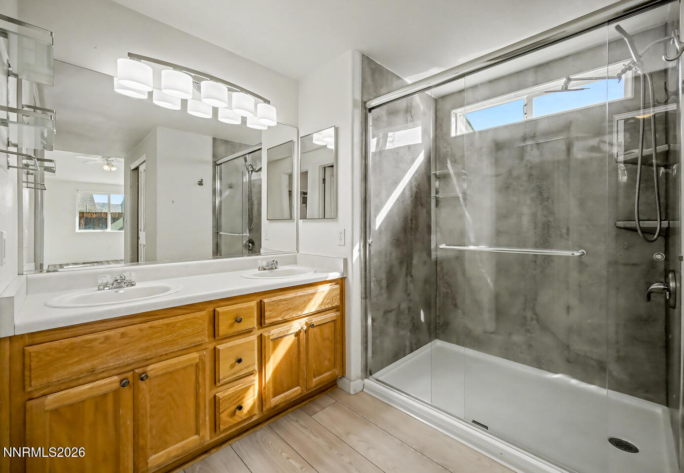 133 Prairie Lane Fernley, NV 89408 - Photo 17 of 22 a bathroom with a bathtub shower sink vanity and mirror