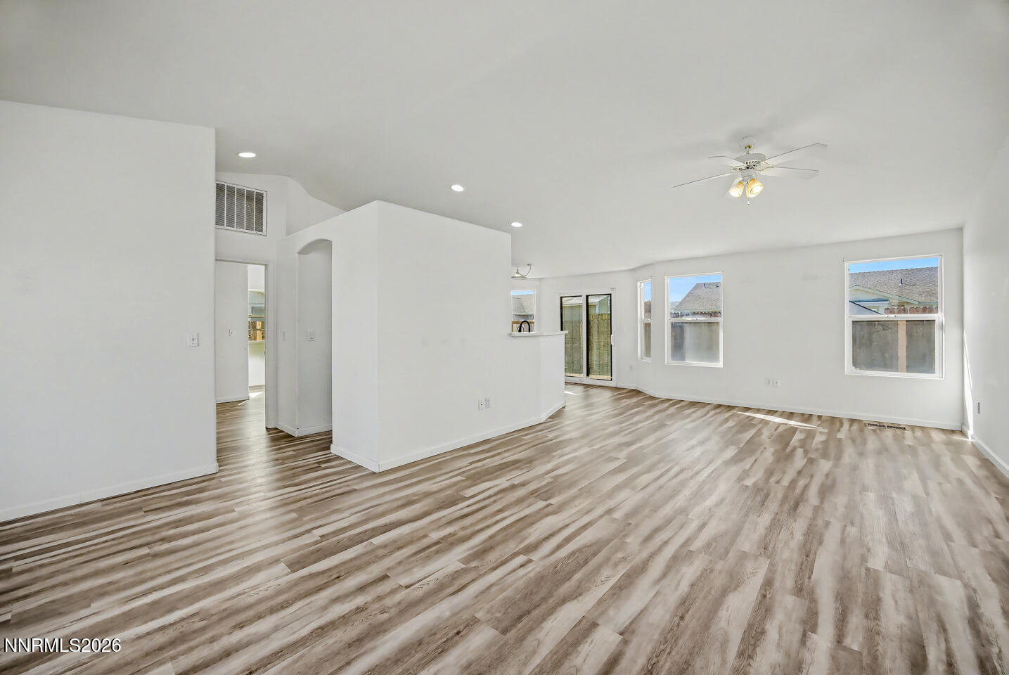 133 Prairie Lane Fernley, NV 89408 - Photo 2 of 22 a view of a livingroom with wooden floor and window