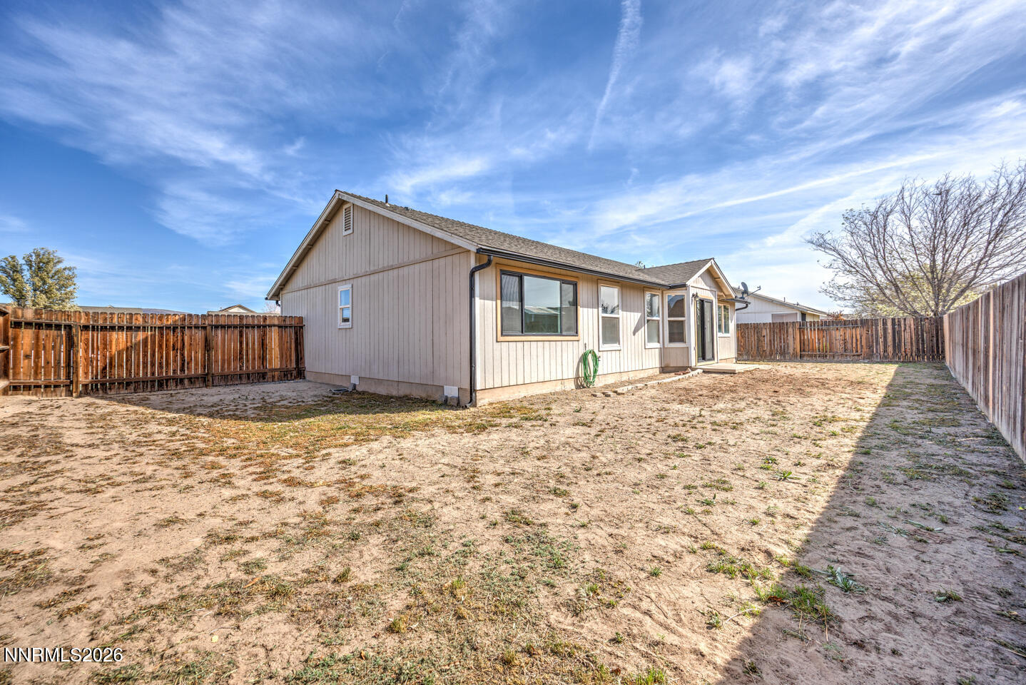 133 Prairie Lane Fernley, NV 89408 - Photo 21 of 22 a house view with a backyard