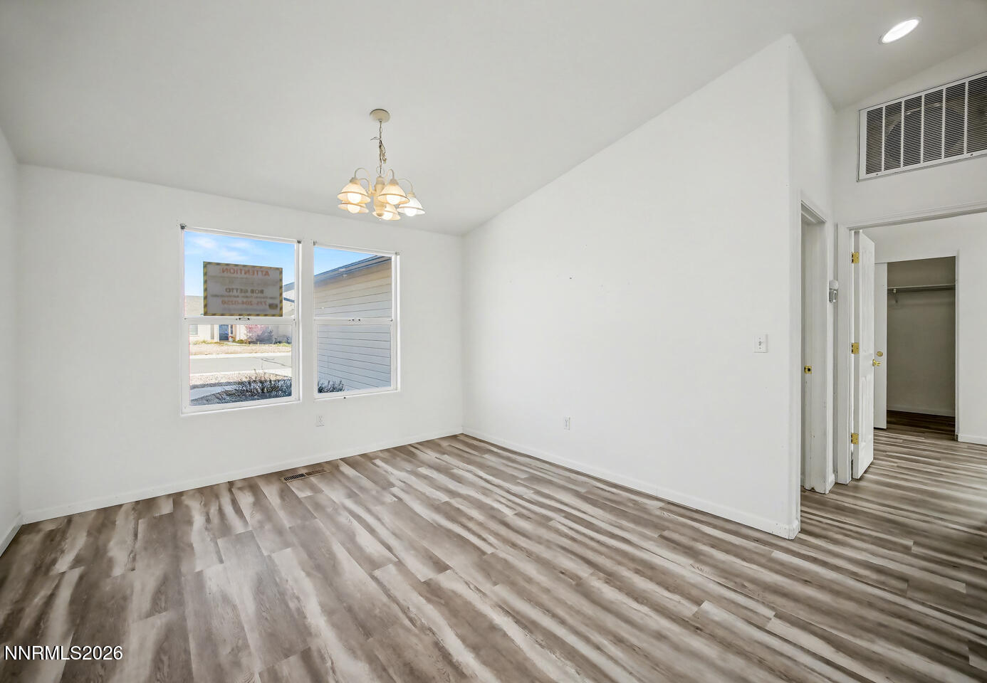 133 Prairie Lane Fernley, NV 89408 - Photo 5 of 22 a view of livingroom with hardwood floor and hallway
