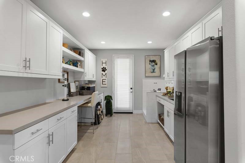 38924 Malva Rosa Drive Palmdale, CA 93551 - Photo 11 of 25 a kitchen with cabinets and stainless steel appliances